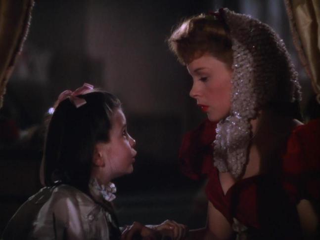 (L-R) Margaret O'Brien, Judy Garland. Image from Meet Me in St. Louis (1944) just before the song begins.