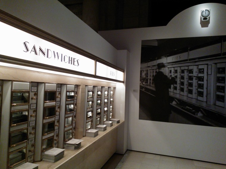 Horn & Hardart display (with recipe cards piled on  ledge) and Berenice Abbott 1936 image on far wall. Image by Martha Wade Steketee.