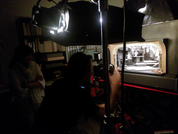 L-R Mikiko Suzuki-MacAdams (designer and model restorer), Plamen Petkov (photographer). Applying his deep and detailed photographic methods to this deep and detailed theatrical set model. Image by Martha Wade Steketee.