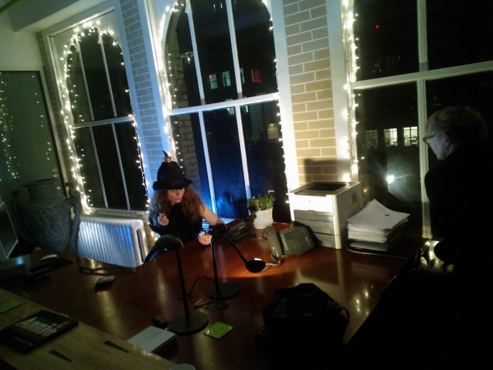 Fairy lights in situ, Ich Kurbegeist performer ponders a desk. Note publication about Korins 2013 design for the Annie revival on the desk at left.